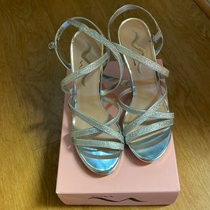 Silver heels , never worn